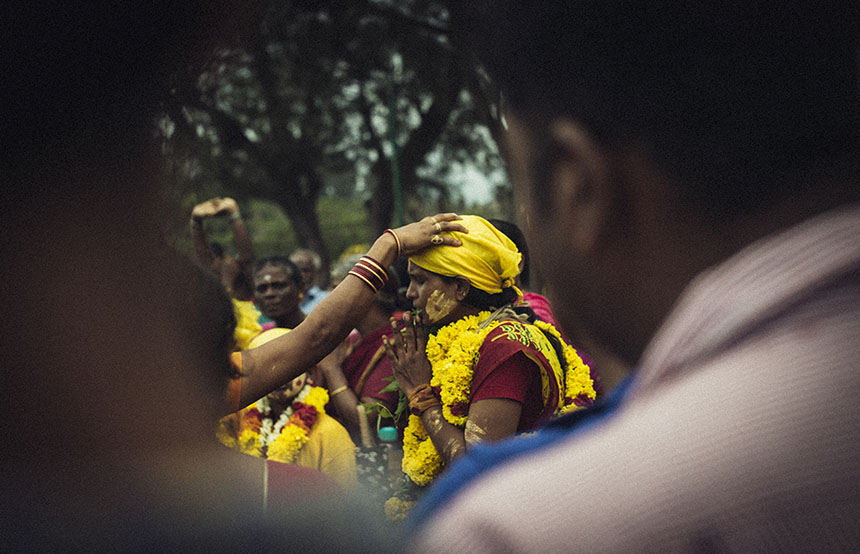 Woman praying, India