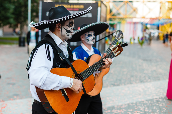 Two men playing guitar