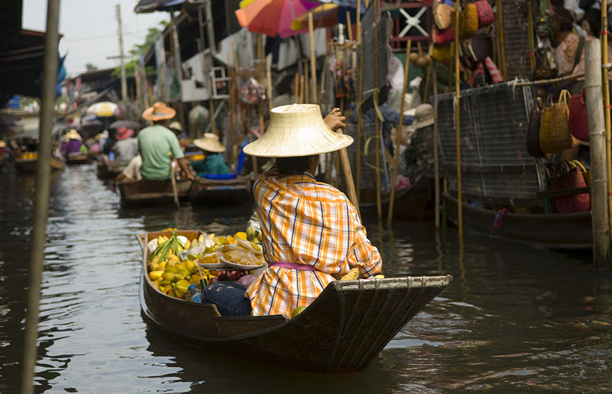 Floating market on a river in Thailand