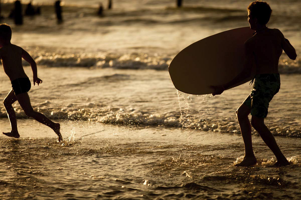 Children surfing in California