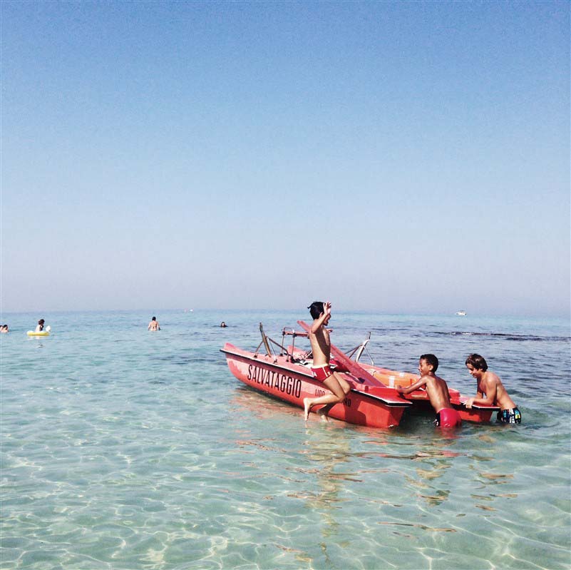 Kids playing on a small boat - Italy