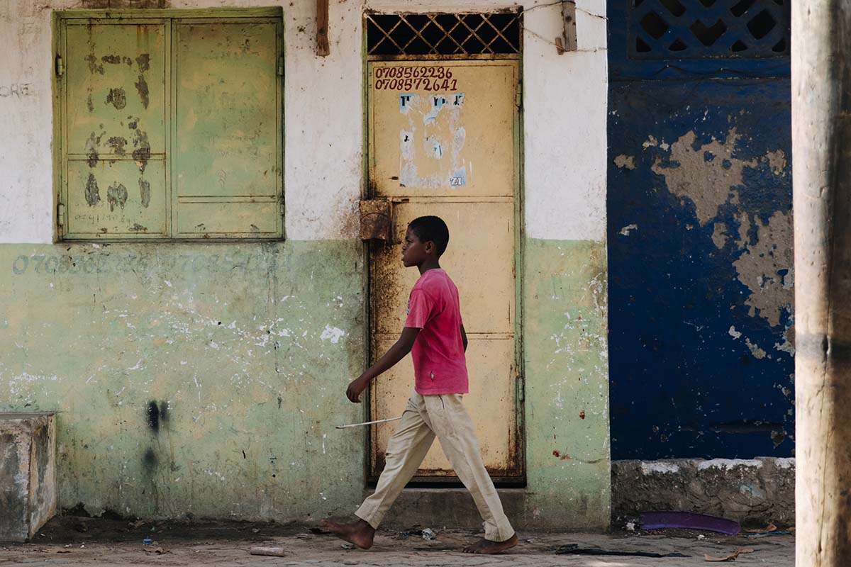 Young man walking in the street - Kenya