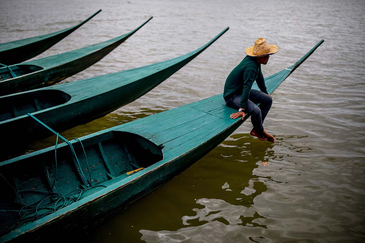 Man on a boat - Laos