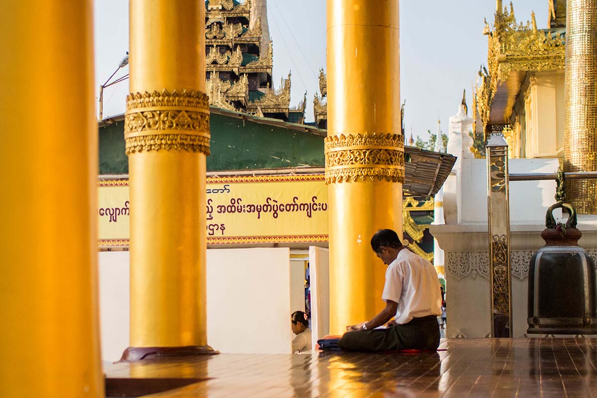 Man praying in Myanmar